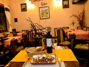Un restaurant u otro lugar para comer en La Casa del Tata