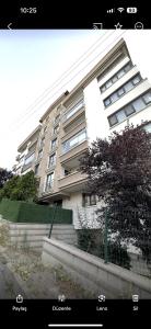 a large white building with stairs in front of it at Corner splash in Ankara