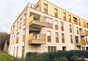 a building with balconies on the side of it at Villa Karmel modern 3 bedroom appartment in Blankenberge