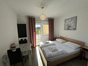 Postel nebo postele na pokoji v ubytování Apartmani Lisičina
