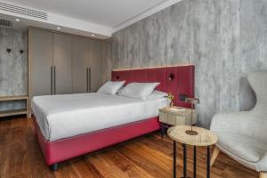 Postel nebo postele na pokoji v ubytování Garda Suite Hotel - Tonelli Hotels