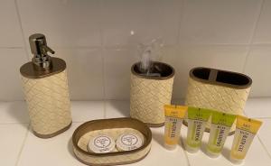 a kitchen counter with two trash cans and a sink at Nw2 Studio Flat mins to London in London