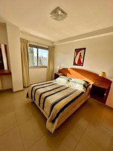 Postel nebo postele na pokoji v ubytování Depto "Encantable" Pleno Centro, Pile en Terraza, Aire Ac