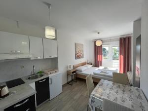 Postel nebo postele na pokoji v ubytování Apartmani Lisičina