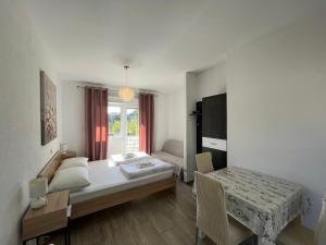 Postel nebo postele na pokoji v ubytování Apartmani Lisičina