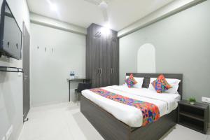 a bedroom with a large bed in a room at Via Alpha in Gurgaon