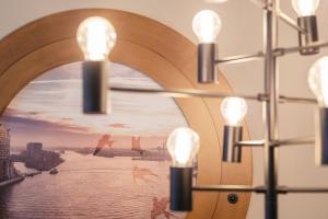 a chandelier with a view of a river at Holiday Inn - the niu, Yen Hamburg City by IHG in Hamburg