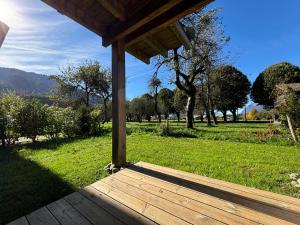 a wooden porch with a view of a park at Agora in Samoëns