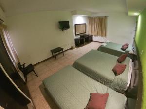 Postel nebo postele na pokoji v ubytování Hotel y Restaurante Ritz de Tabasco