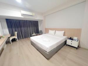 Voodi või voodid majutusasutuse The Space Hotel Chiang Rai toas