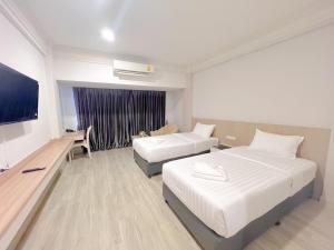 Voodi või voodid majutusasutuse The Space Hotel Chiang Rai toas