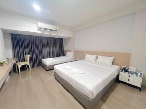 Voodi või voodid majutusasutuse The Space Hotel Chiang Rai toas