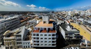 an aerial view of a city with buildings at Stay Hotel Faro Centro in Faro