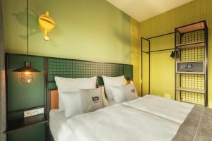 Holiday Inn - the niu, Dwarf Berlin Schöneberg by IHG 객실 침대
