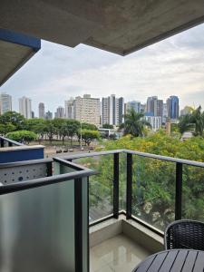 a balcony with a view of the city at Apto studio, coracao de maringa in Maringá
