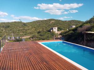 a swimming pool on the roof of a house at CABAÑAS CAMPO CHICO in Trapiche