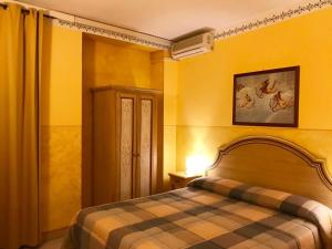 Postel nebo postele na pokoji v ubytování Hotel La Dimora