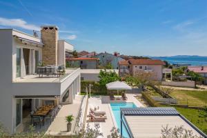 an aerial view of a house with a swimming pool at Villa Milagros in Kožino