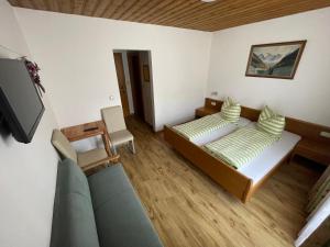 Ένα ή περισσότερα κρεβάτια σε δωμάτιο στο Harbachwirt, Gasthof