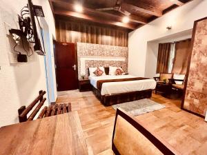 Voodi või voodid majutusasutuse Munnar Tea Estate Cottage and Resort - Away From City Hustle toas