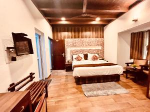 Voodi või voodid majutusasutuse Munnar Tea Estate Cottage and Resort - Away From City Hustle toas