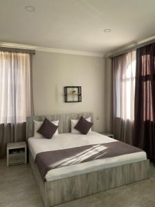 Postel nebo postele na pokoji v ubytování Hotel Menua