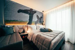 Postel nebo postele na pokoji v ubytování Hotel AX