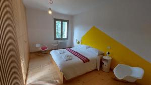 Postel nebo postele na pokoji v ubytování lassù minihotel