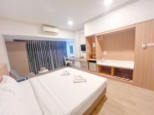 Voodi või voodid majutusasutuse The Space Hotel Chiang Rai toas