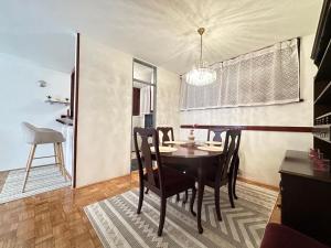 a dining room with a table and chairs at Sarajevo center in Sarajevo