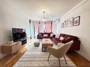 a living room with a couch and a table at Sarajevo center in Sarajevo