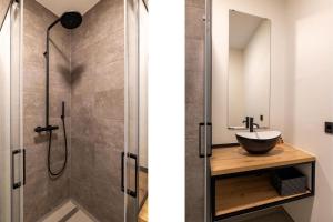 a bathroom with a sink and a shower at Vakantiewoning aan het water - met 2 balkons - Vista Maris - Nr 52 in Sint Annaland