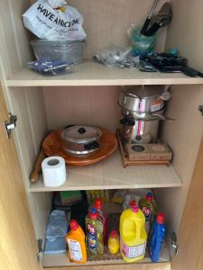 a cupboard filled with lots of food and kitchen items at Appart Meublé Cité ElWahat in El Aouina +7 photos