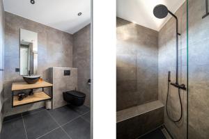 a bathroom with a shower and a sink at Vakantiewoning aan het strand - met tuin en terras - Vista Maris - Nr 34 in Sint Annaland