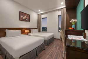 Katil atau katil-katil dalam bilik di Mitisa Hotel Da Nang - Near Dragon Bridge