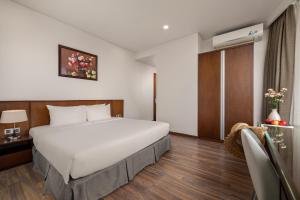 Katil atau katil-katil dalam bilik di Mitisa Hotel Da Nang - Near Dragon Bridge