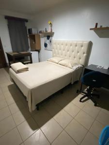 Ένα ή περισσότερα κρεβάτια σε δωμάτιο στο Suite Noa Apartamento