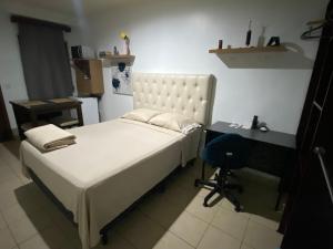 Ένα ή περισσότερα κρεβάτια σε δωμάτιο στο Suite Noa Apartamento