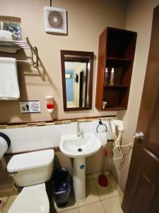 Ein Badezimmer in der Unterkunft Merendon Suite Apartamento