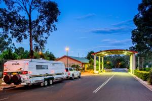 a large white truck parked in front of a church at Discovery Parks - Dubbo in Dubbo