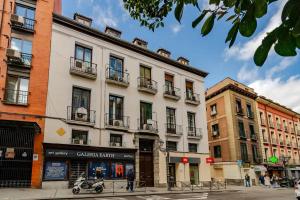 a large white building on a city street at La casa de la escritora in Madrid
