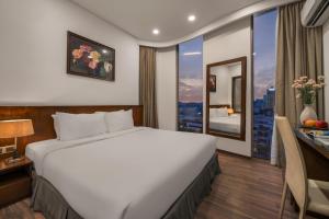 Katil atau katil-katil dalam bilik di Mitisa Hotel Da Nang - Near Dragon Bridge