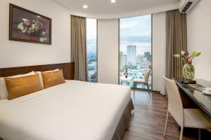 Katil atau katil-katil dalam bilik di Mitisa Hotel Da Nang - Near Dragon Bridge