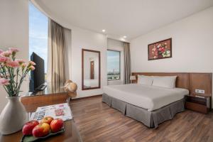 Katil atau katil-katil dalam bilik di Mitisa Hotel Da Nang - Near Dragon Bridge