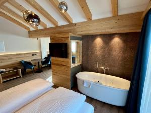 Postel nebo postele na pokoji v ubytování Hotel Alpi