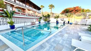 a swimming pool in the middle of a building at Villa Lujo y Relax in Adeje by Deihu Experiences in Adeje