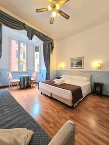 Postel nebo postele na pokoji v ubytování Hotel Porta Pia