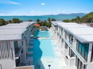 an aerial view of a building with a swimming pool at Beach Walk Condo 3br in Replay residence in Bang Rak Beach