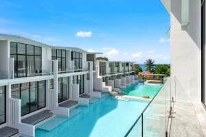 an image of a building with a swimming pool at Beach Walk Condo 3br in Replay residence in Bang Rak Beach