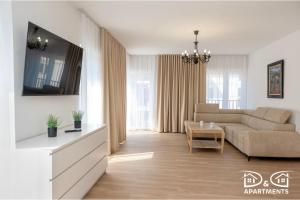 a living room with a couch and a table at Pine Tree House 9 D&D Apartments in Międzywodzie